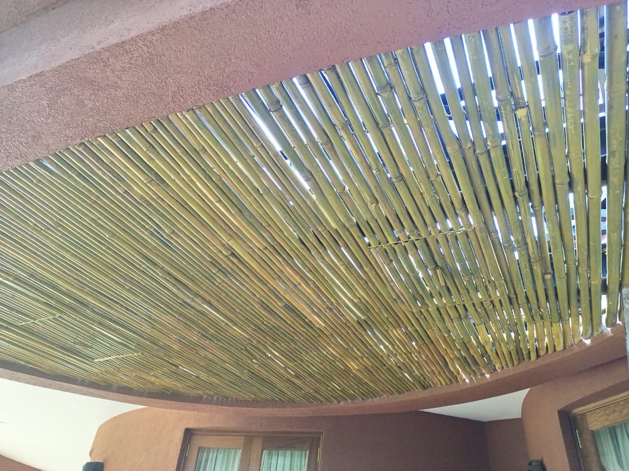 Bespoke bamboo ceiling systems, crafted from premium bamboo full culm poles Location Ngewe House Tatu City Transform your spaces with our bespoke bamboo ceiling systems, crafted from premium bamboo full culm poles and guided by precise species selection for the job. Each installation is thoughtfully designed to deliver structural integrity, durability, and a refined natural aesthetic that complements both modern and organic architecture. We specialize in bespoke & biophilic design, creating ceilings that reconnect people with nature while elevating spatial experience. The result is a warm, calming, and visually striking environment—ideal for residential homes, hospitality spaces, offices, and high-end commercial interiors. Our comprehensive supply and fix services ensure seamless execution from sourcing and treatment to expert installation. With a focus on quality craftsmanship and sustainable design, we deliver bamboo ceiling solutions that are not only beautiful, but built to last.